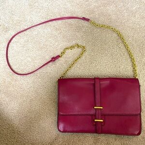 Small red/purple Coach clutch